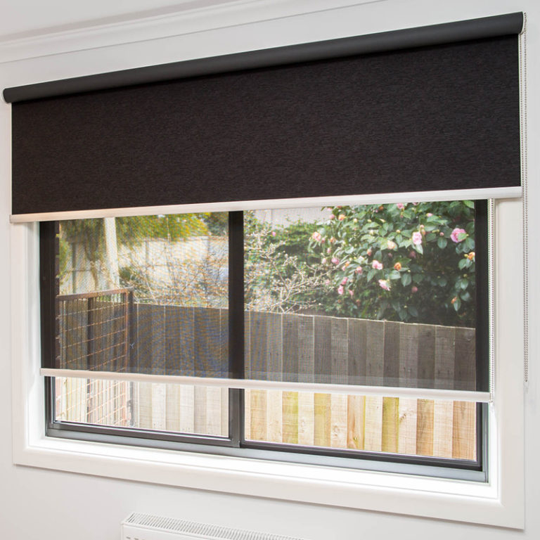 Blockout Roller blinds Melbourne open with a view of the backyard fence