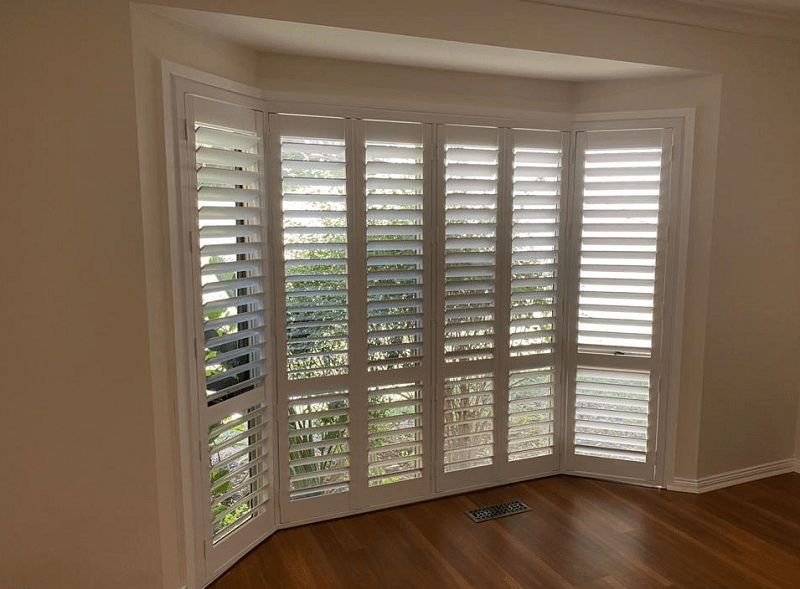 Bay Window with white PVC plantation Shutters